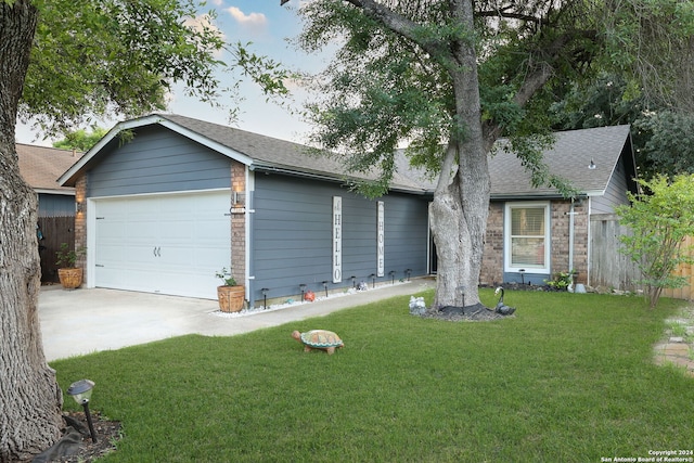 ranch-style house with a front lawn and a garage