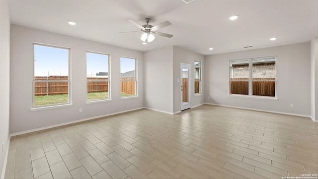 empty room with light hardwood / wood-style flooring and ceiling fan