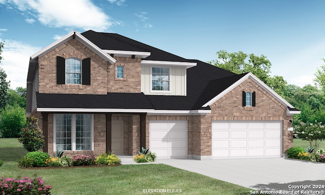 view of front of house featuring a garage and a front lawn