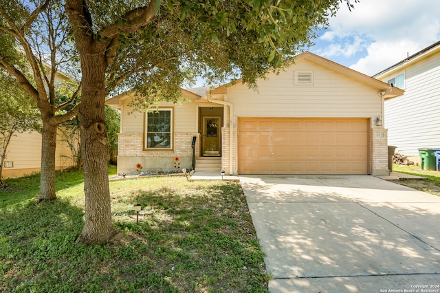 ranch-style home with a garage and a front yard