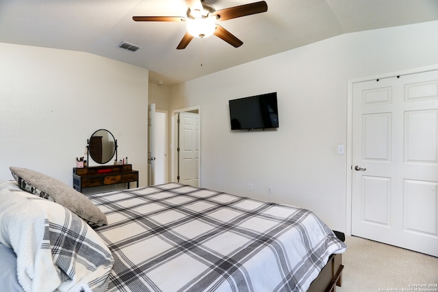 carpeted bedroom featuring lofted ceiling and ceiling fan