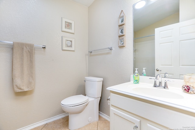 bathroom featuring toilet, tile patterned flooring, vanity, a shower, and lofted ceiling