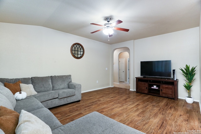 living room with vaulted ceiling, hardwood / wood-style flooring, and ceiling fan