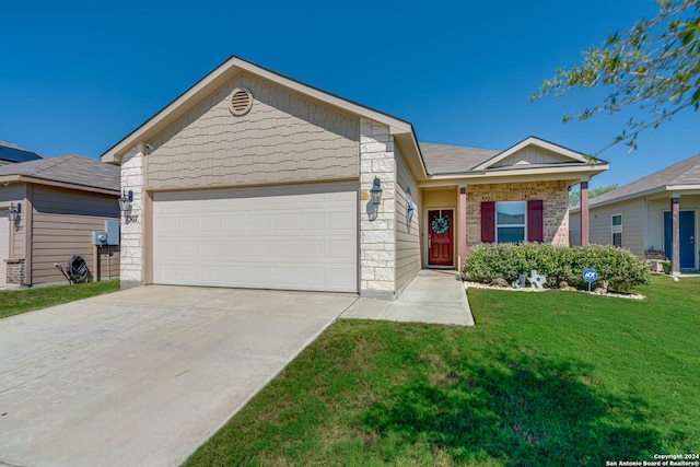 view of front of home featuring a garage and a front lawn