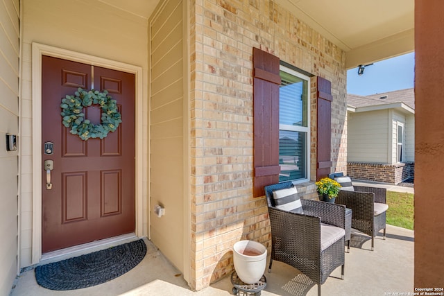 property entrance featuring a porch