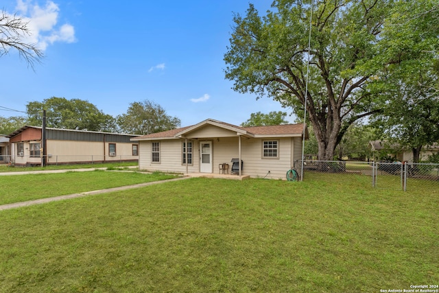 ranch-style home featuring a patio and a front yard