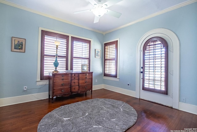 foyer with ceiling fan, ornamental molding, and dark hardwood / wood-style floors