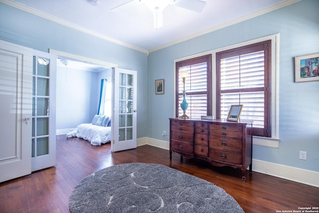 living area featuring crown molding, dark wood-type flooring, french doors, and ceiling fan