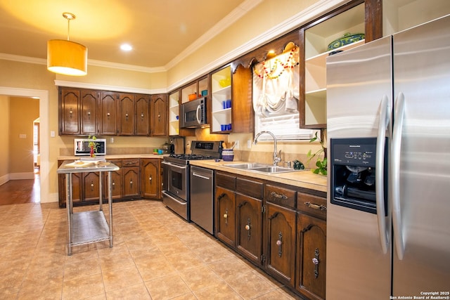 kitchen featuring appliances with stainless steel finishes, sink, light tile patterned floors, and decorative light fixtures