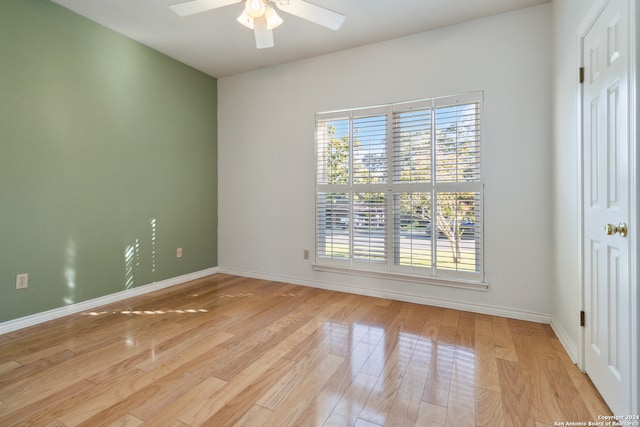 spare room with ceiling fan and light hardwood / wood-style floors