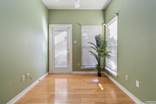 unfurnished room with ceiling fan and light hardwood / wood-style floors