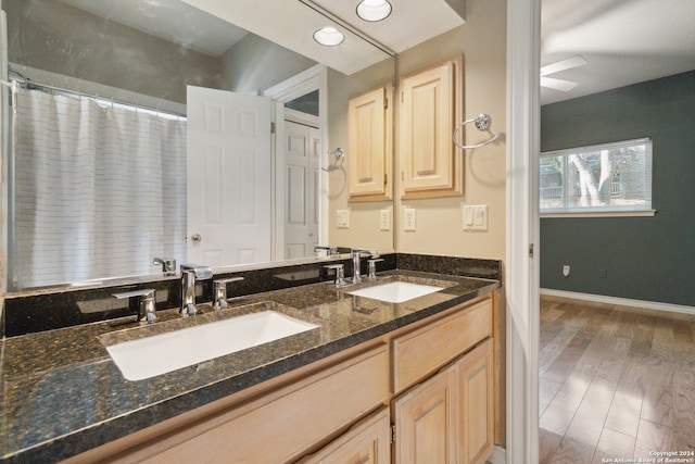 bathroom with vanity and hardwood / wood-style flooring