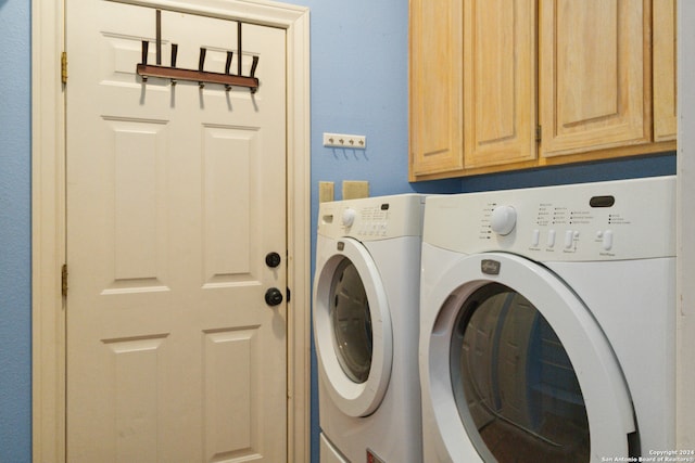 laundry area with cabinets and independent washer and dryer