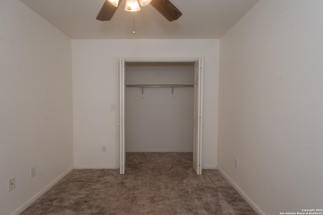 unfurnished bedroom with carpet, ceiling fan, and a closet