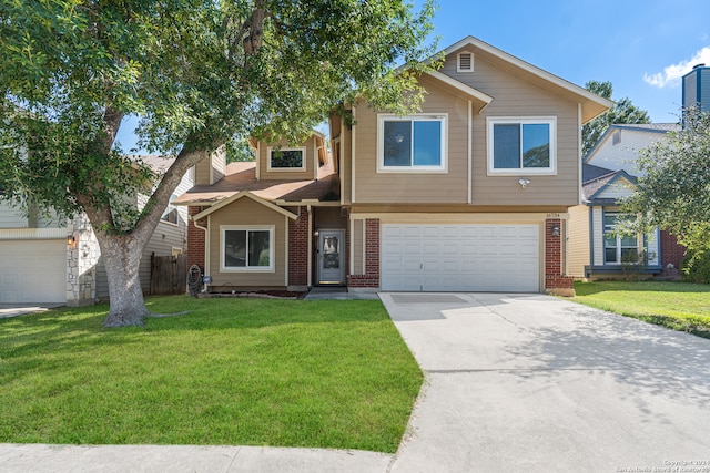 view of front of property with a front yard and a garage