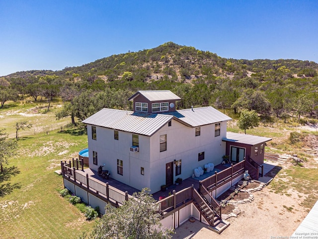 birds eye view of property with a mountain view