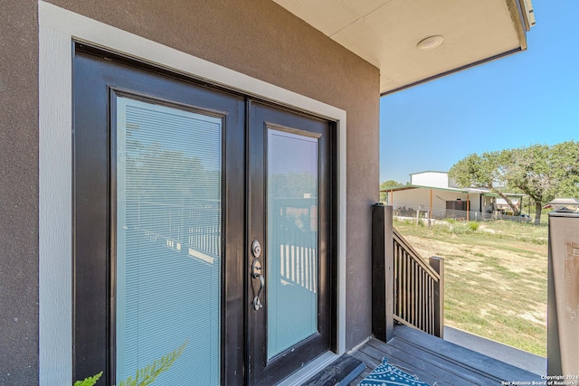 property entrance featuring french doors