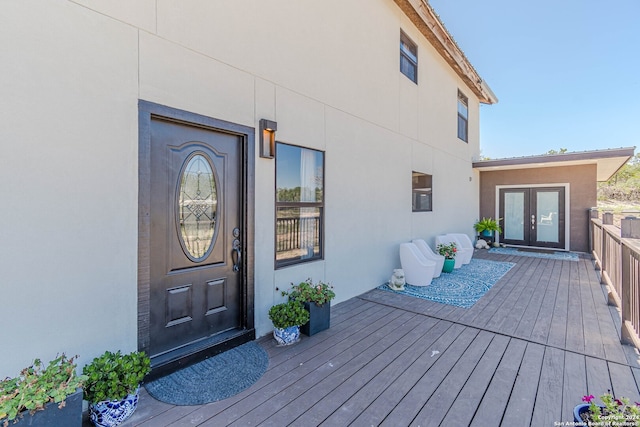 property entrance with french doors and a deck