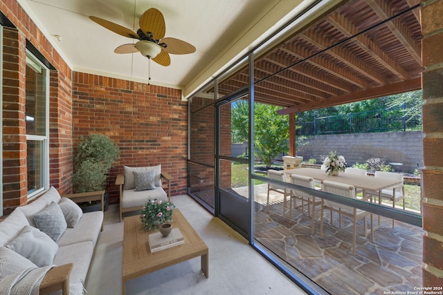 sunroom / solarium with ceiling fan and a wealth of natural light