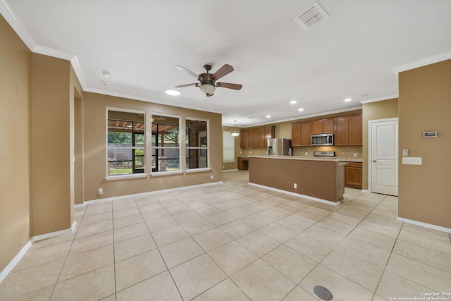 kitchen with a kitchen island, backsplash, appliances with stainless steel finishes, ceiling fan, and light tile patterned flooring