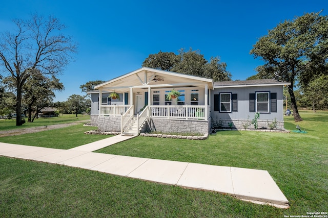 view of front facade with a porch and a front lawn