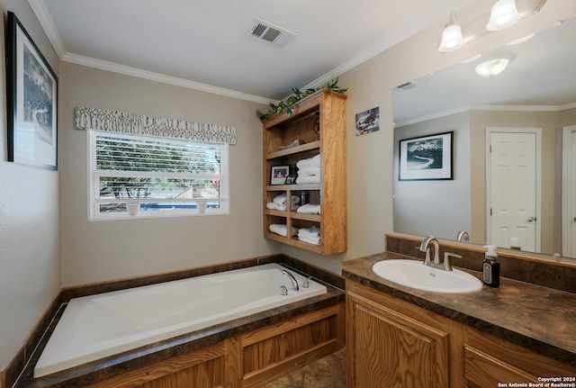 bathroom with ornamental molding, vanity, a bathing tub, and tile patterned flooring