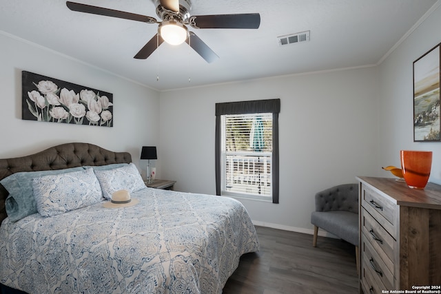 bedroom featuring crown molding, ceiling fan, and dark hardwood / wood-style floors