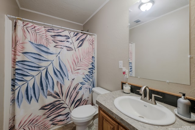 bathroom with curtained shower, crown molding, toilet, vanity, and a textured ceiling