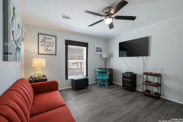 living room featuring ceiling fan and wood-type flooring