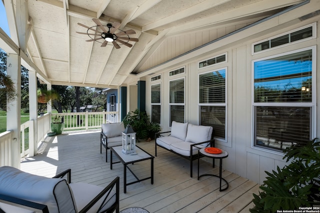 wooden terrace featuring outdoor lounge area and ceiling fan