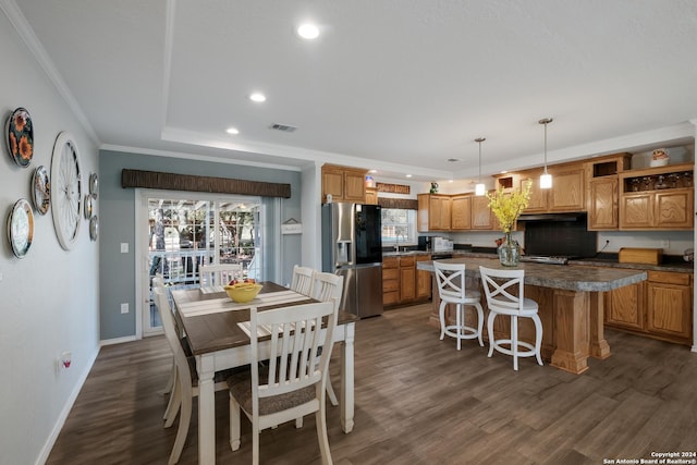 1350 Blue Quail Dr, Lytle, TX 78052 - dining area featuring recessed lighting, a raised ceiling, visible vents, crown molding, and dark wood-style flooring