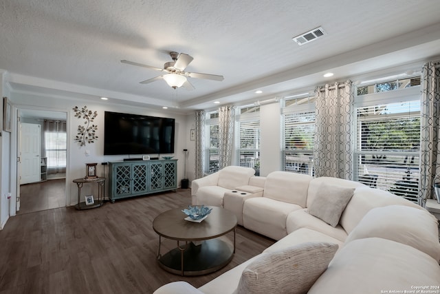 living room with dark wood-type flooring, a textured ceiling, and ceiling fan