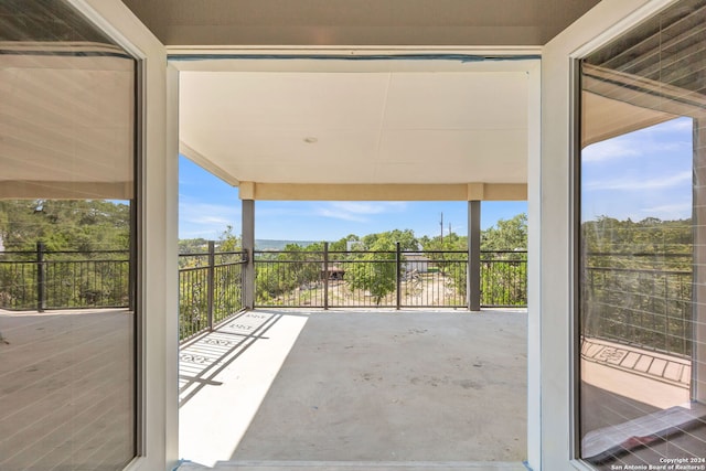 view of patio featuring a balcony