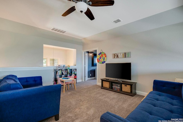 living room with ceiling fan and light carpet