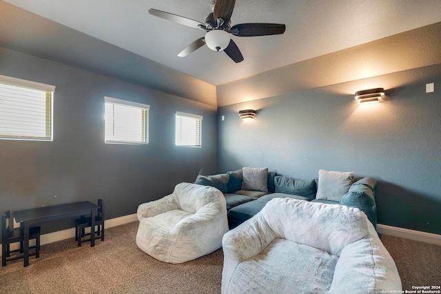 cinema room featuring carpet and ceiling fan