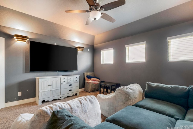 carpeted living room featuring ceiling fan