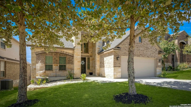 view of front facade with cooling unit and a front yard