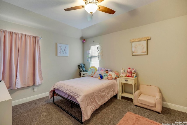 bedroom with dark colored carpet and ceiling fan