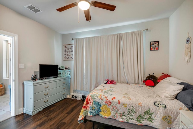 bedroom with ceiling fan and dark hardwood / wood-style flooring