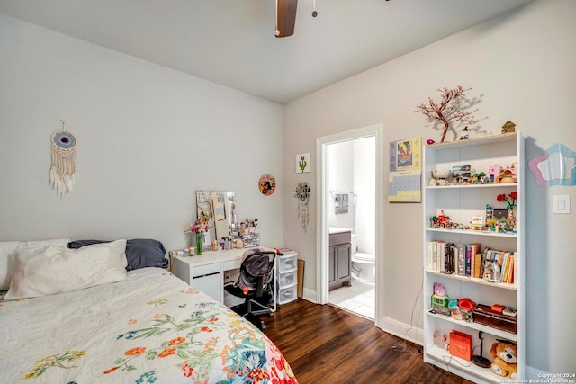 bedroom with ceiling fan, dark hardwood / wood-style floors, and ensuite bath