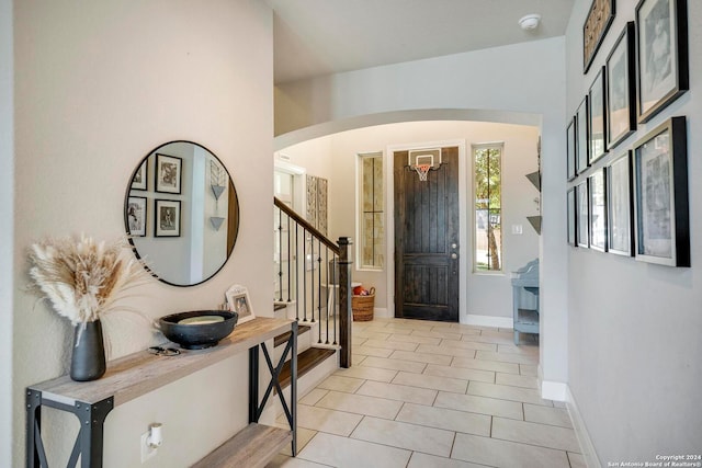 foyer entrance featuring light tile patterned floors