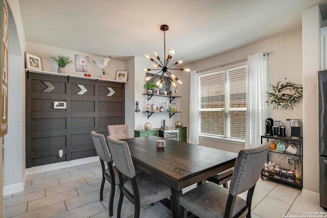 tiled dining area featuring a notable chandelier