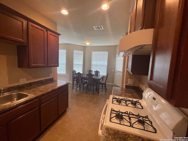 kitchen with gas range gas stove and sink