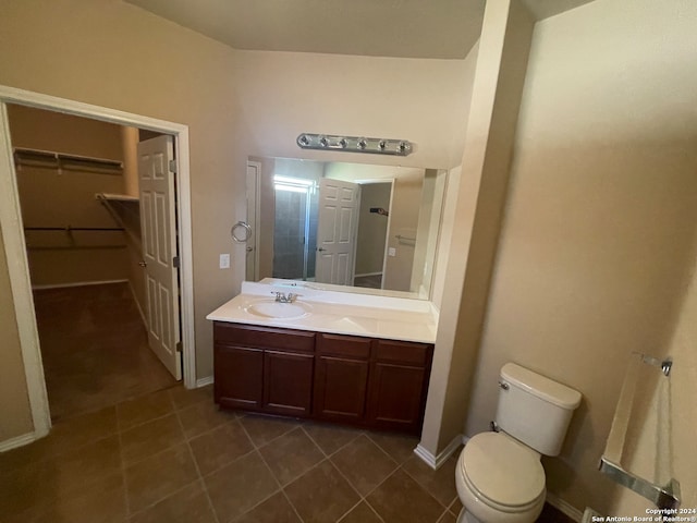 bathroom featuring vanity, toilet, and tile patterned floors