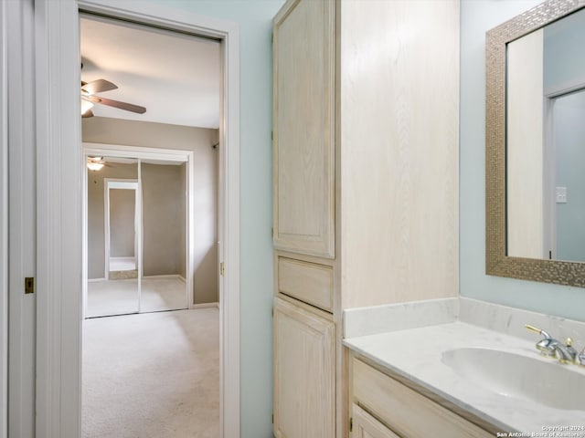 bathroom with ceiling fan and vanity