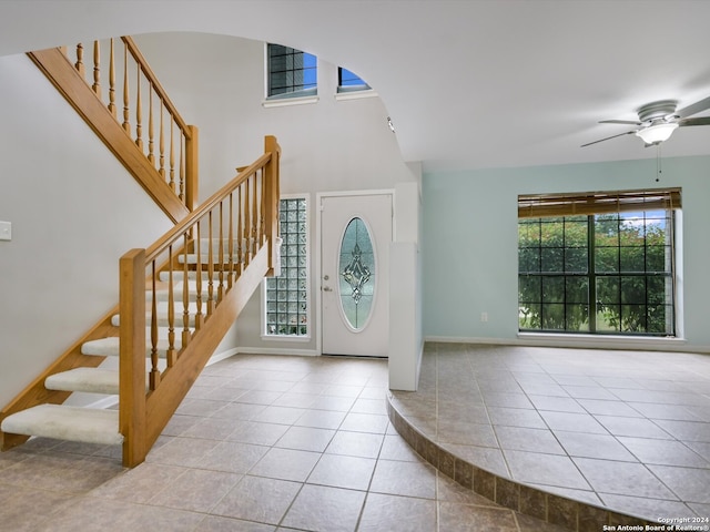 entrance foyer with ceiling fan and light tile patterned floors