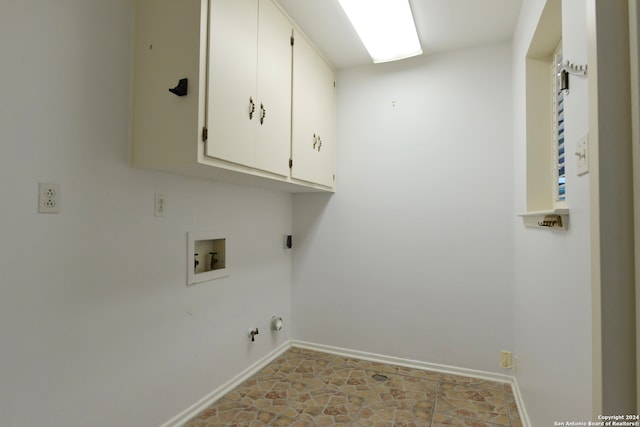 laundry area with hookup for a gas dryer, electric dryer hookup, washer hookup, and cabinets