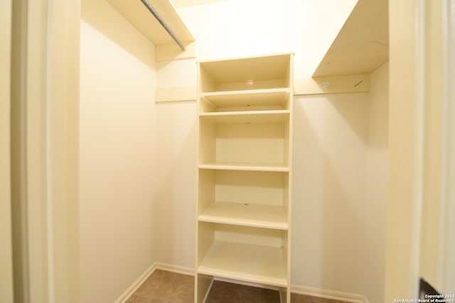 walk in closet featuring tile patterned floors