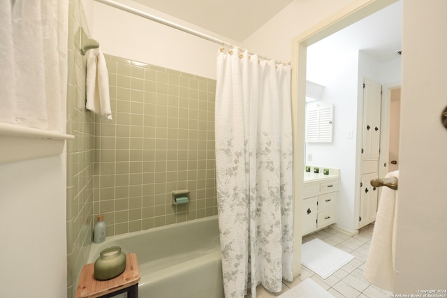 bathroom with shower / bath combination with curtain and tile patterned flooring