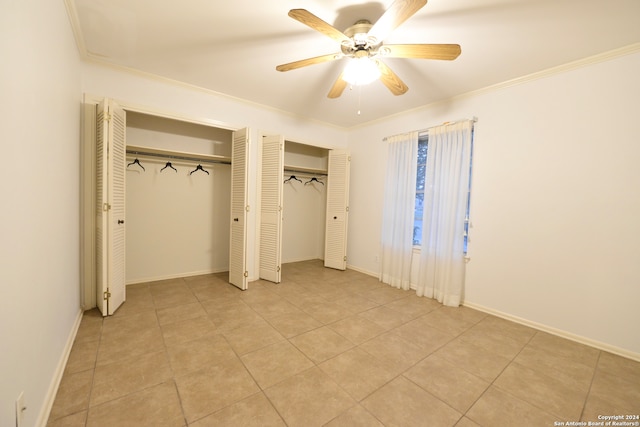 unfurnished bedroom featuring crown molding, light tile patterned floors, and ceiling fan